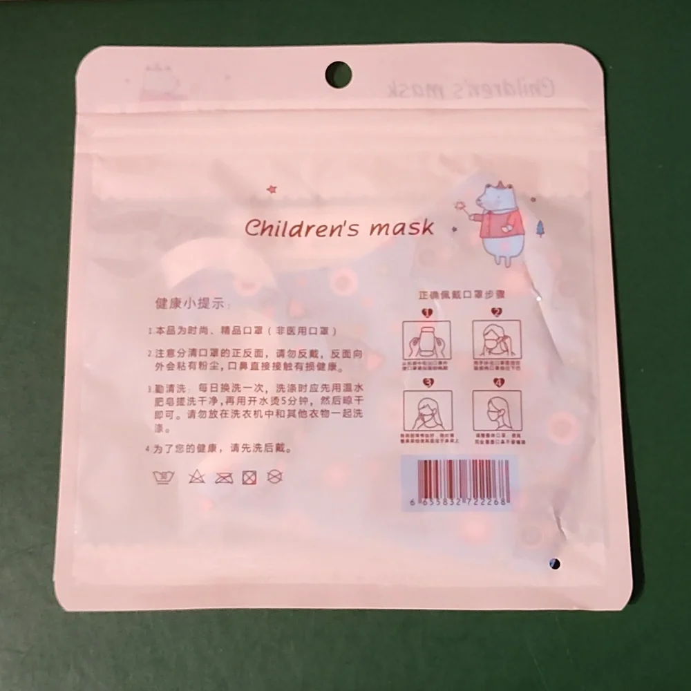Children's re Usable face mask new in package never opened
